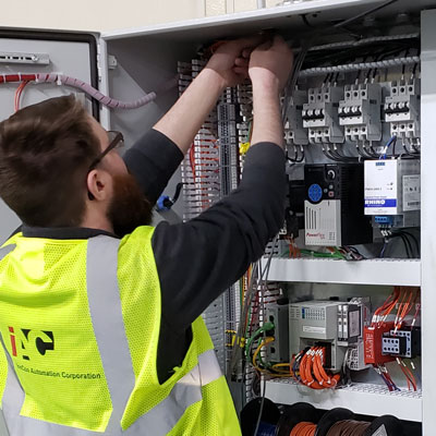 InnCon Technician servicing a panel